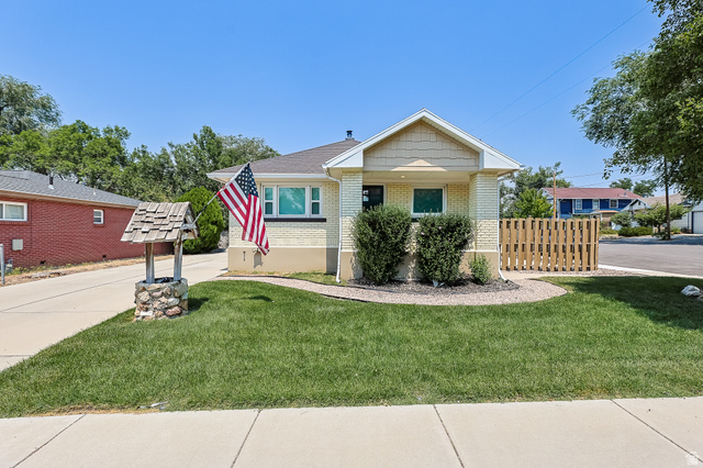 59 East 8680th Street South Sandy, UT 84070 - Photo 1 of 33 Single-story residence featuring light-colored brick siding, a gabled entry, and a contrasting shingle roof
