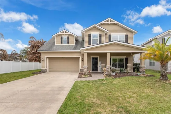 a front view of a house with patio and yard