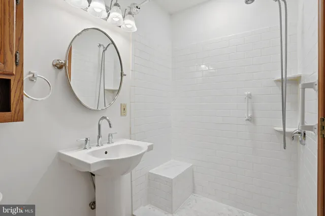 a kitchen that has a sink and a stove in it