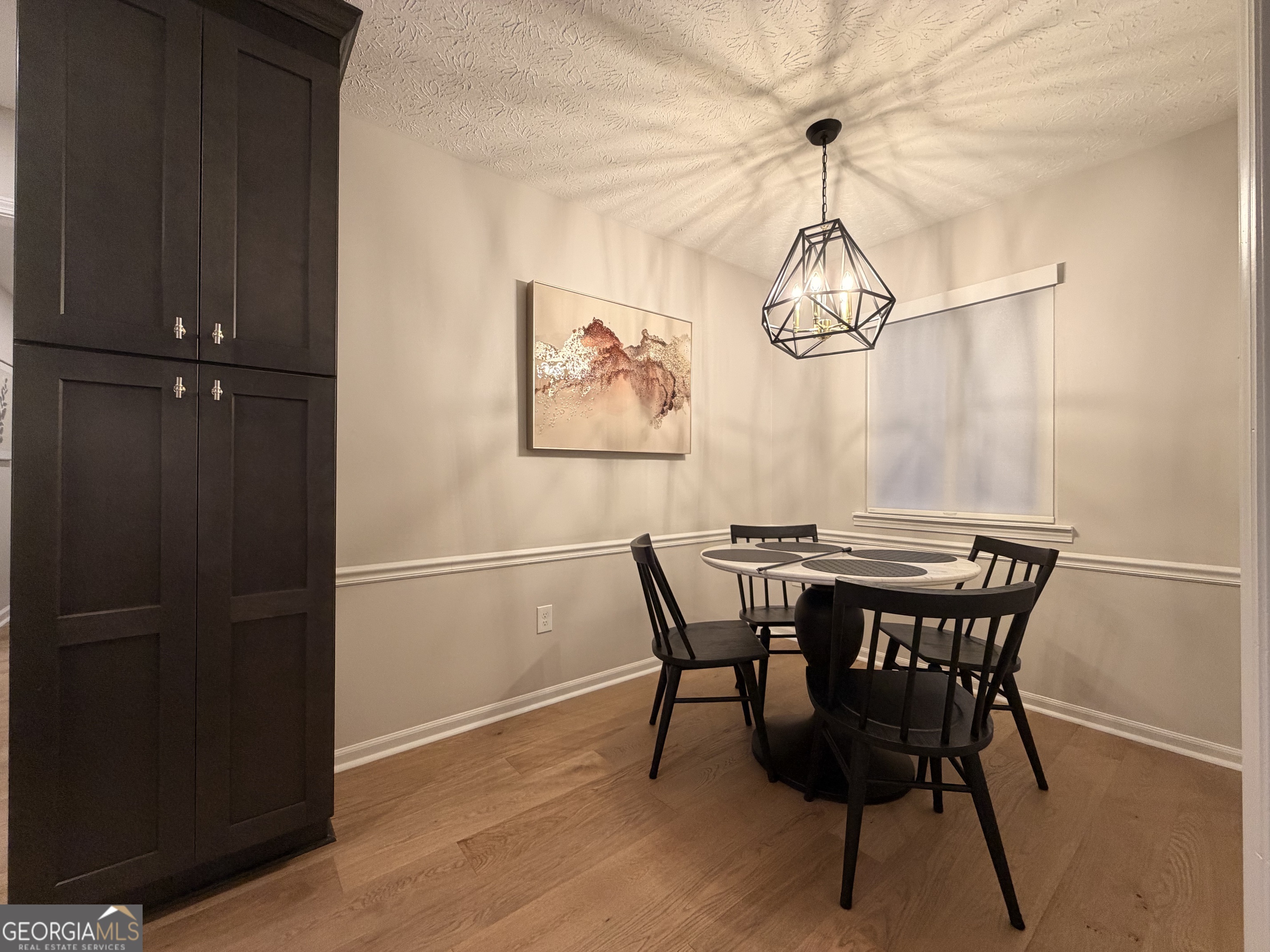 174 Talmadge Street, Unit 14 Athens, GA 30605 - Photo 7 of 11 a view of a dining room with furniture window and wooden floor