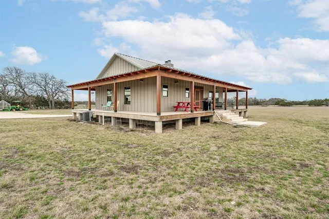 a blue and white house with outdoor space