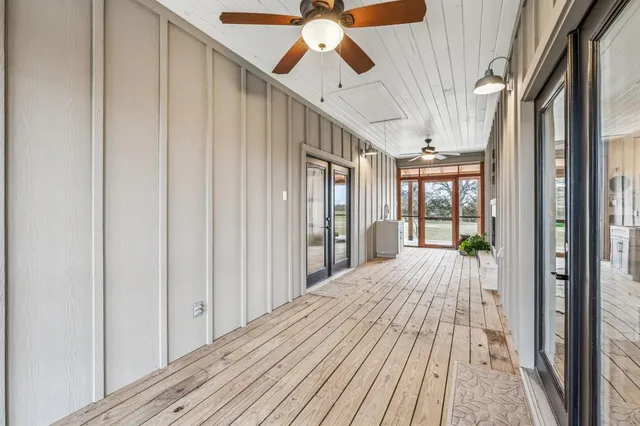 a view of balcony with wooden floor