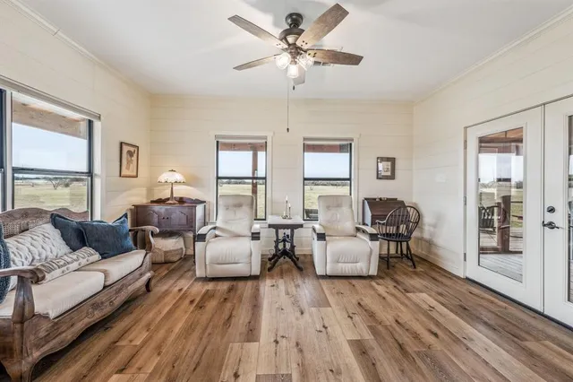 a living room with furniture and a large window