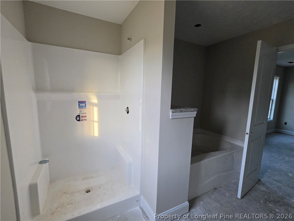 756 Jordan Road Autryville, NC 28318 - Photo 27 of 34 a bathroom with a bathtub