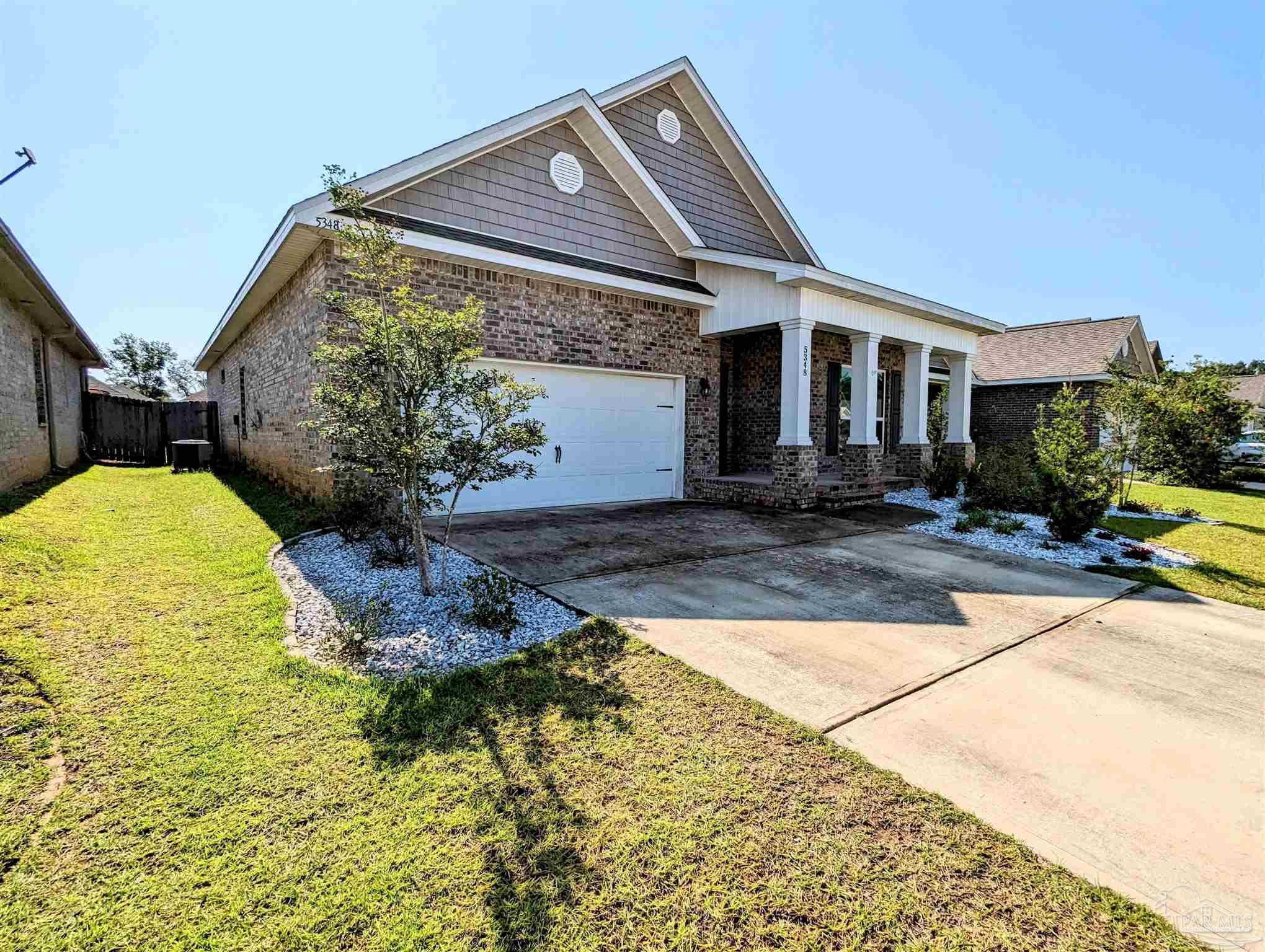 5348 Red Shoulder Road Pace, FL 32571 - Photo 3 of 39 a front view of a house with a yard