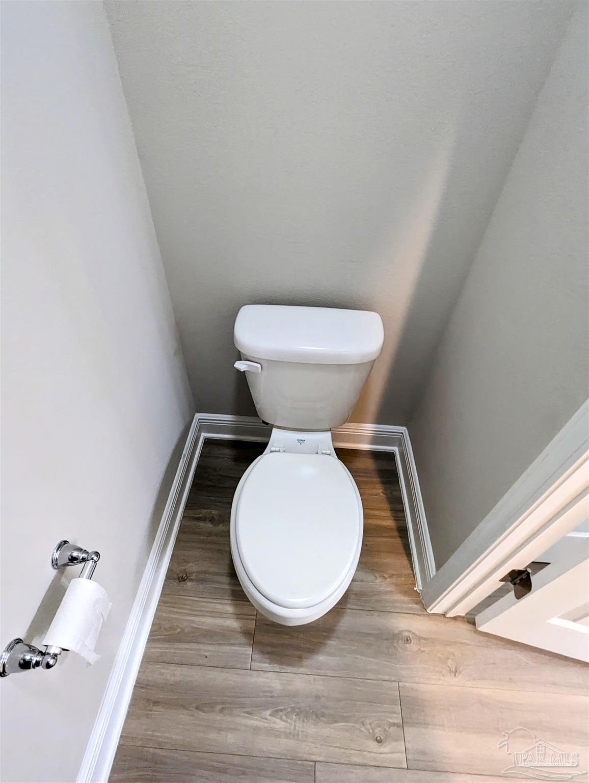 5348 Red Shoulder Road Pace, FL 32571 - Photo 33 of 39 a bathroom with a toilet and a rug