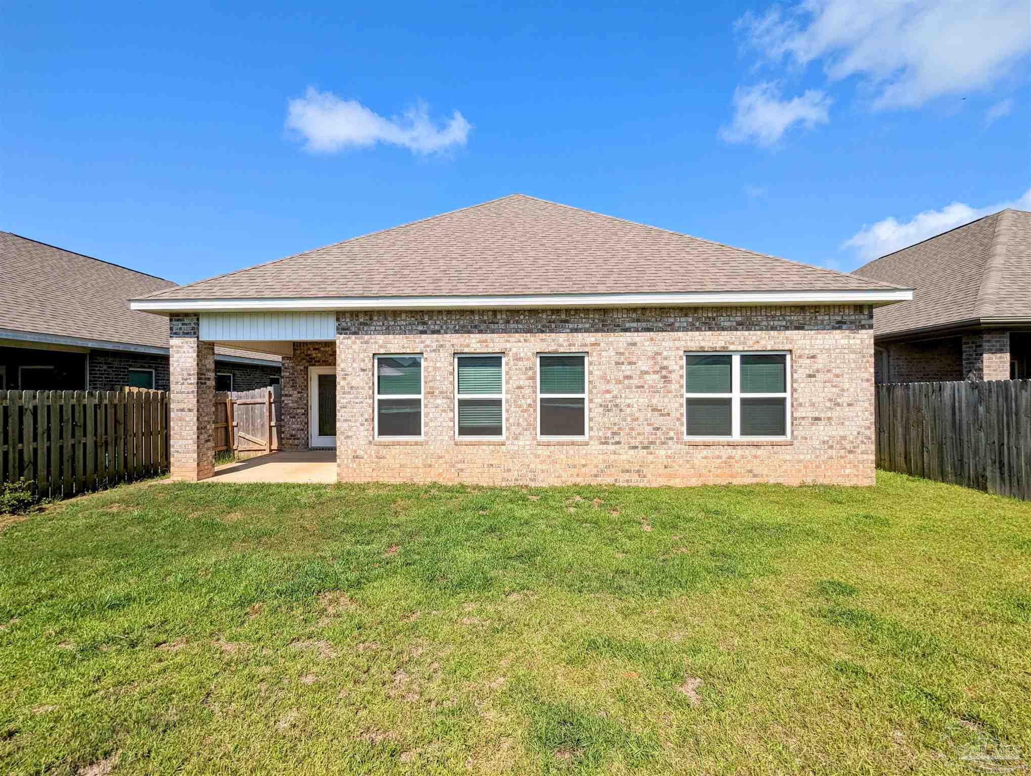 5348 Red Shoulder Road Pace, FL 32571 - Photo 38 of 39 front view of a house with a yard