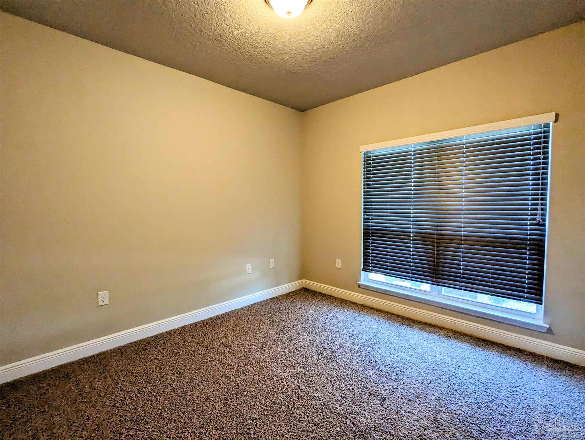 5348 Red Shoulder Road Pace, FL 32571 - Photo 6 of 39 a view of wooden floor and a window in an empty room