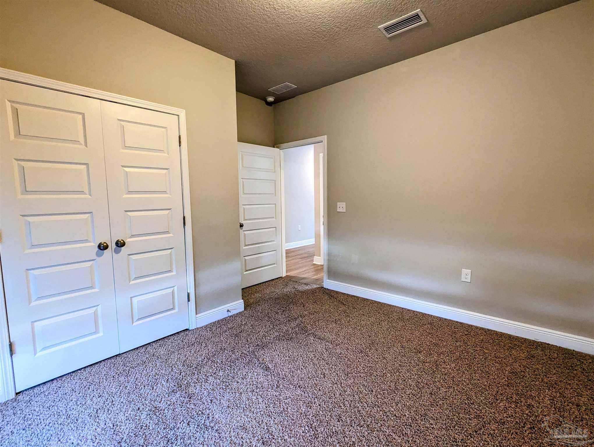 5348 Red Shoulder Road Pace, FL 32571 - Photo 8 of 39 an empty room with closet