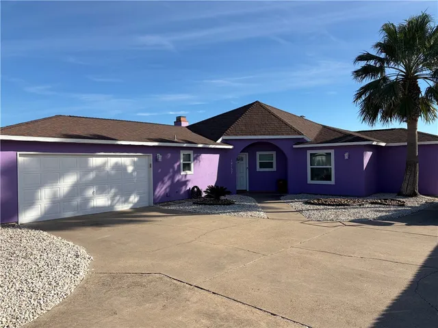 a front view of a house with yard