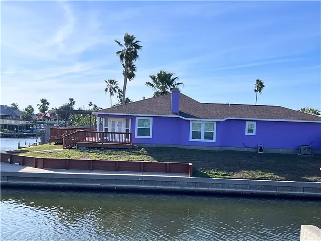 a view of house with swimming pool yard and outdoor seating