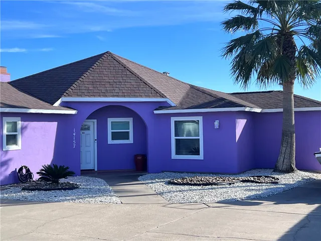 a view of a lake with a house in the background