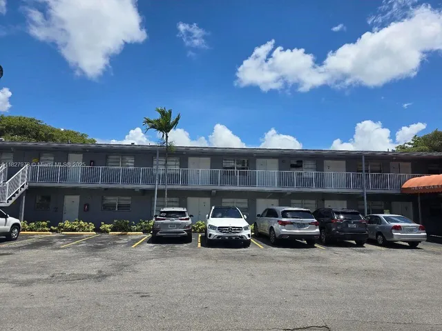 a view of parking with cars parked