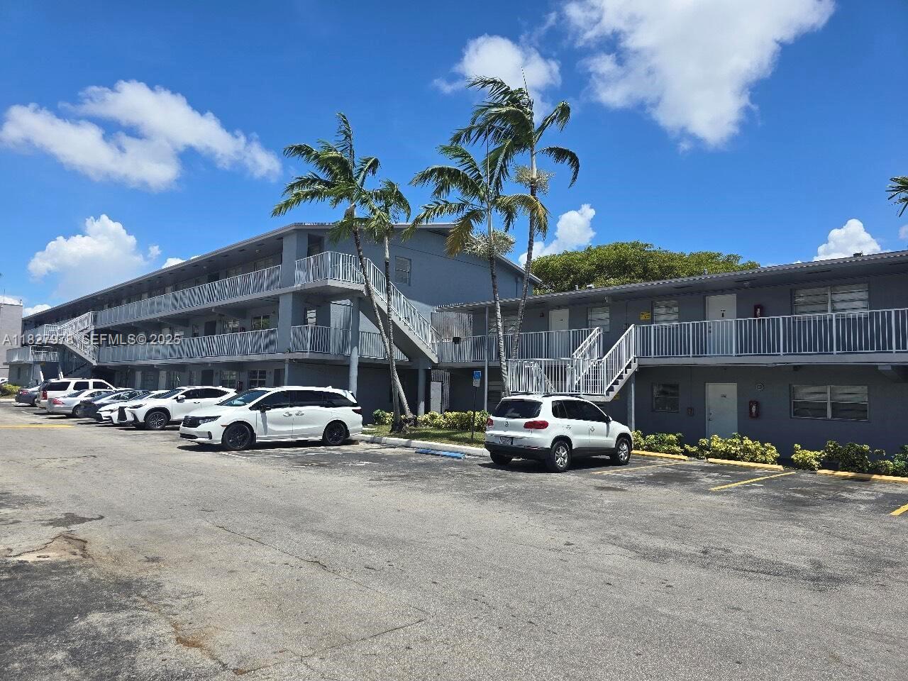1401 Northwest 103rd Street, Unit 139 Miami, FL 33147 - Photo 2 of 11 a view of street with cars