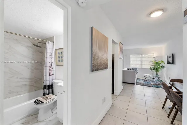 a bathroom with a bathtub and toilet