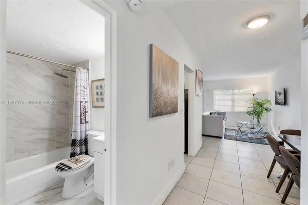 a bathroom with a bathtub and toilet