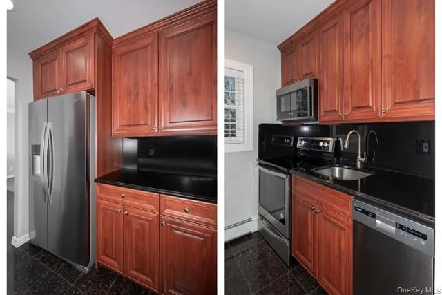 a kitchen with granite countertop wooden cabinets and stainless steel appliances