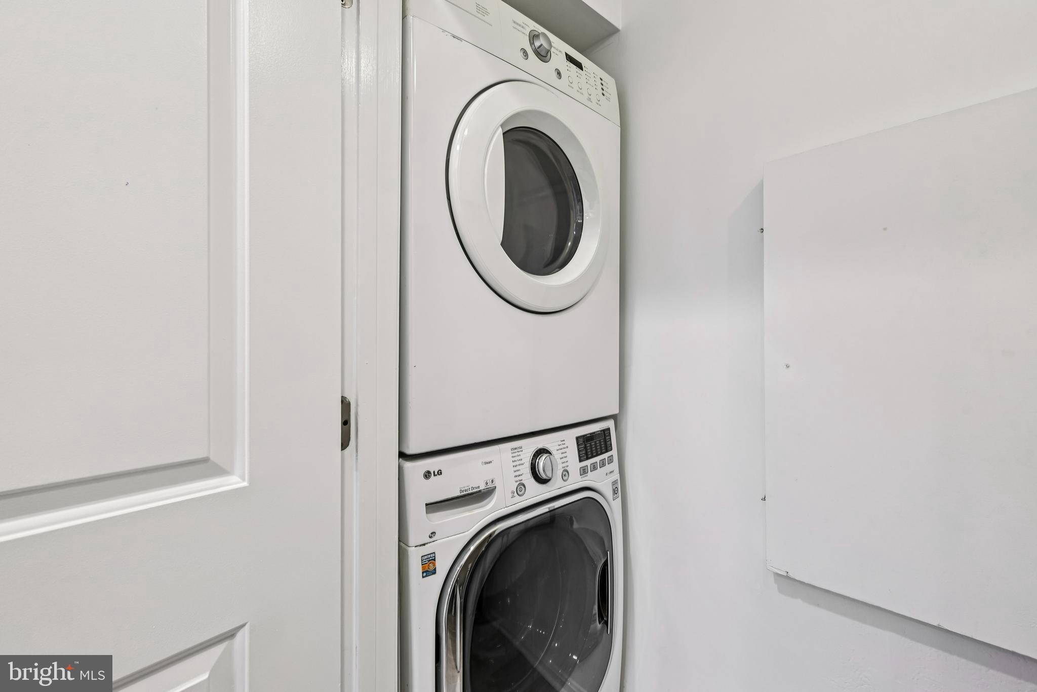 14901 Cleese Court, Unit 5CE Silver Spring, MD 20906 - Photo 12 of 25 a utility room with dryer and washer