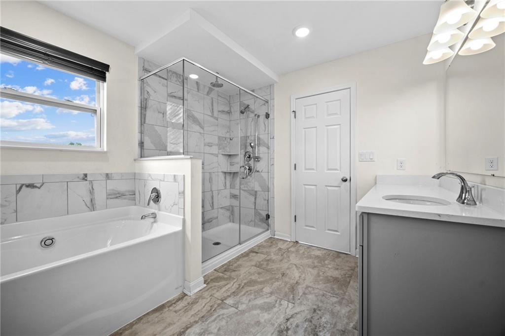 269 Lily Ridge Drive Canonsburg, PA 15317 - Photo 23 of 48 a bathroom with a tub sink shower and mirror