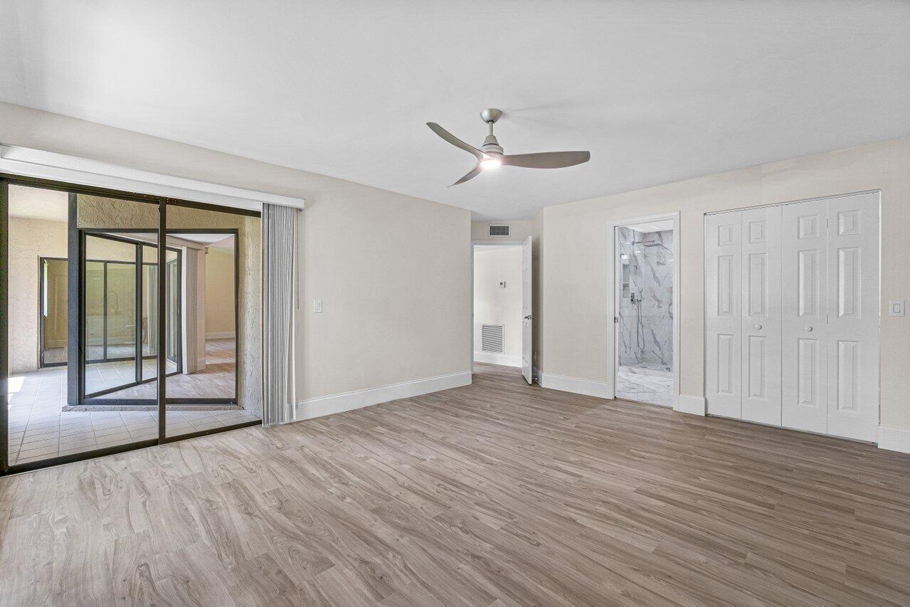 5560 Coach House Circle, Unit B Boca Raton, FL 33486 - Photo 16 of 30 PRIMARY SUITE OPENS TO PATIO