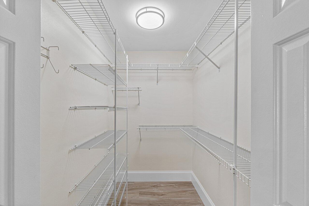 5560 Coach House Circle, Unit B Boca Raton, FL 33486 - Photo 20 of 30 PRIMARY WALK IN CLOSET