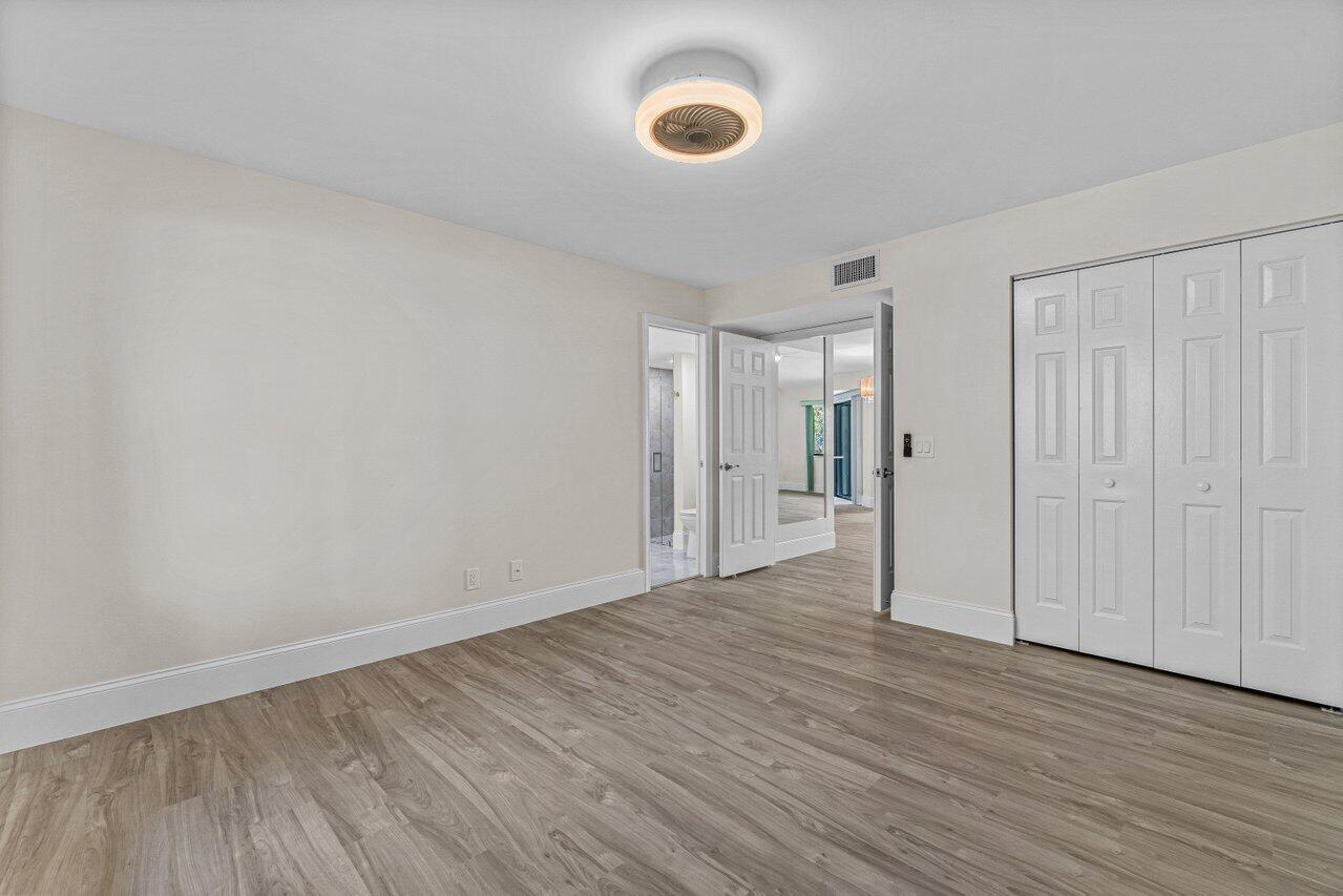 5560 Coach House Circle, Unit B Boca Raton, FL 33486 - Photo 21 of 30 GUEST SUITE WITH PRIVATE BATH