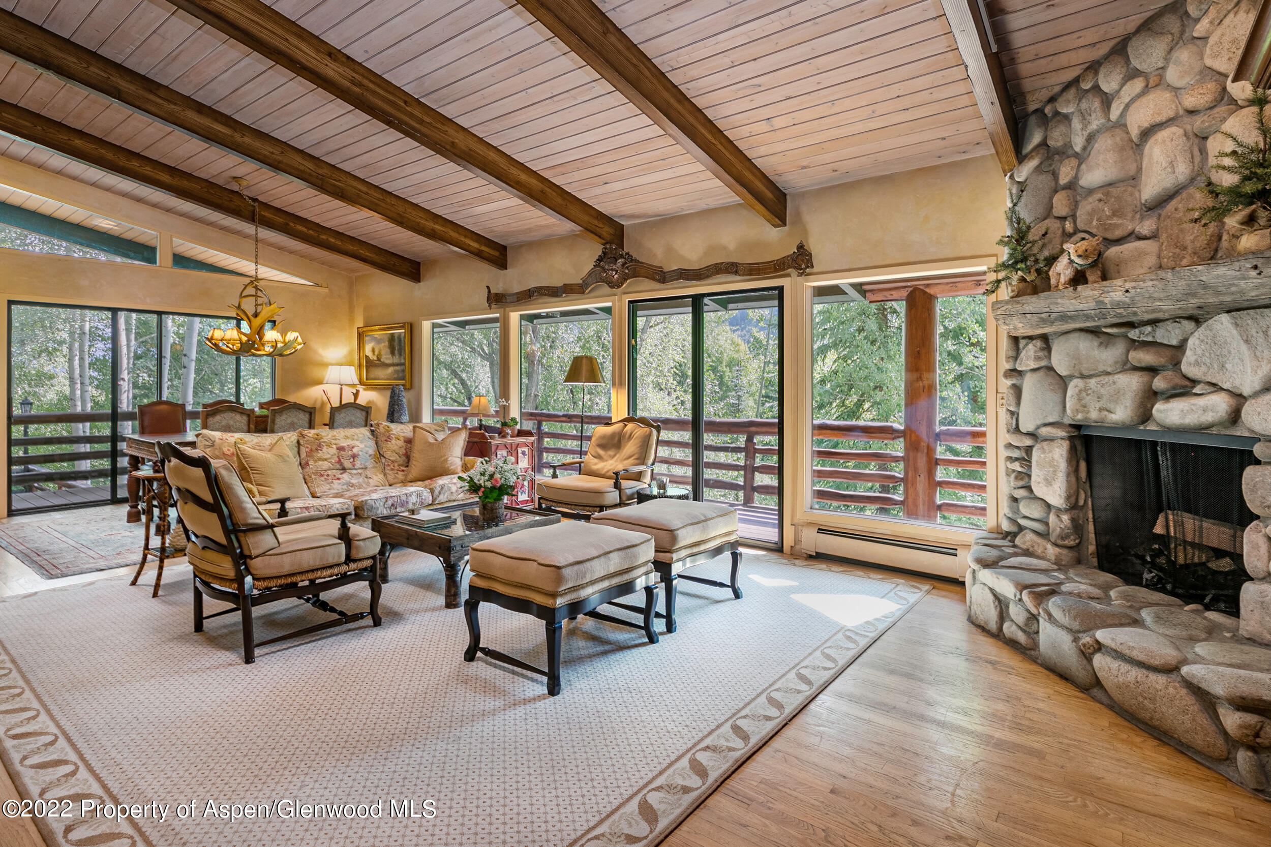 42791 Highway 82 Aspen, CO 81611 - Photo 2 of 19 a living room with furniture and a fireplace