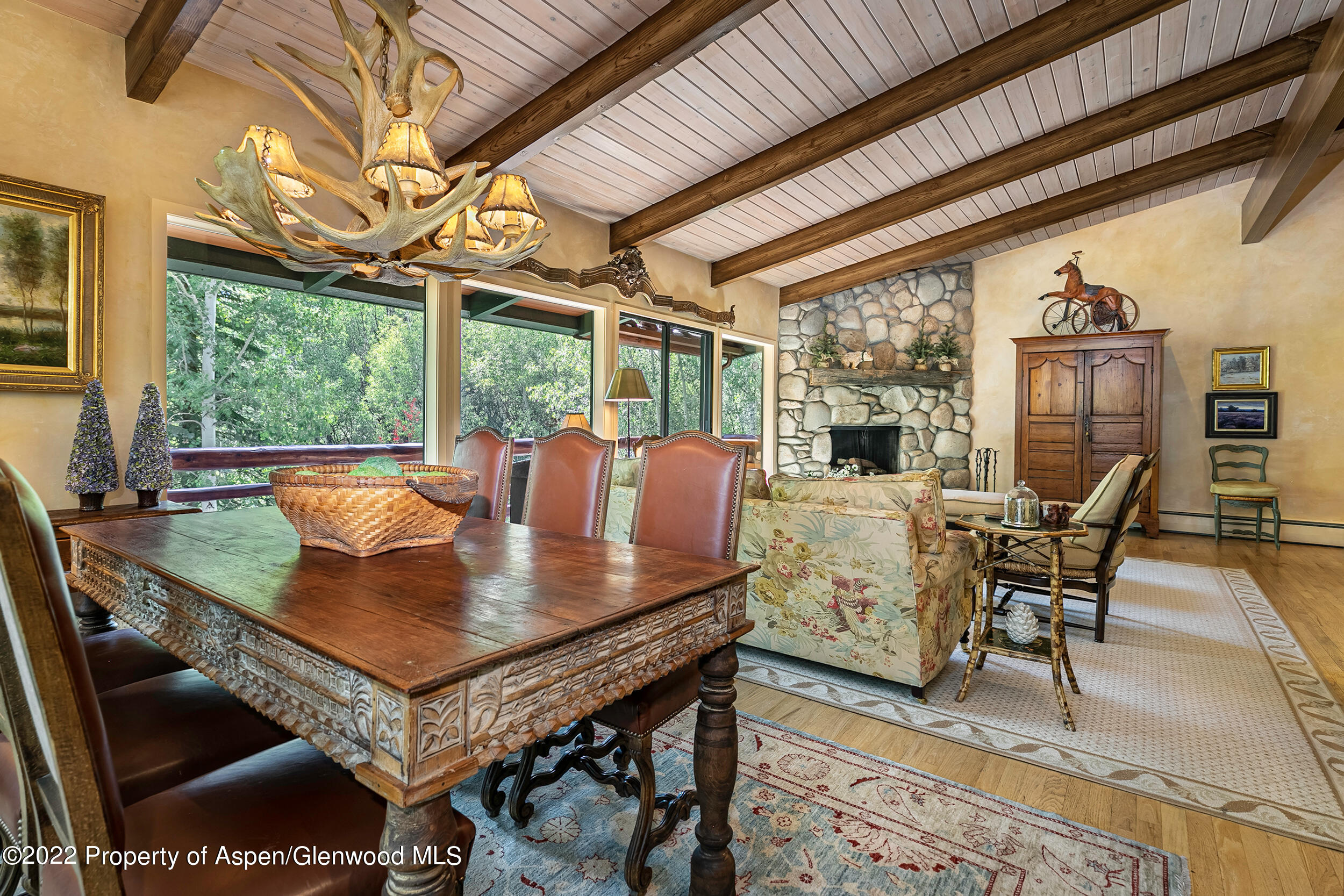 42791 Highway 82 Aspen, CO 81611 - Photo 3 of 19 a dining room with furniture a rug and a large window