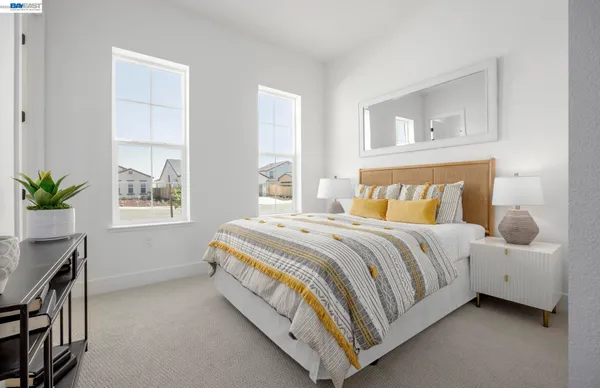 a bedroom with a bed and window