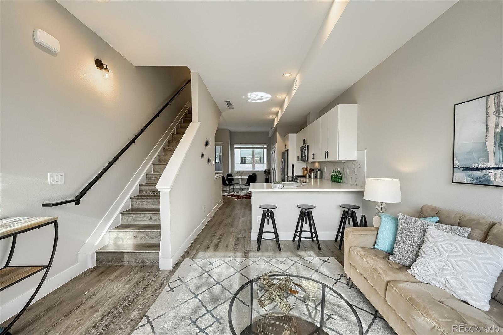 3820 Jason Street, Unit 6 Denver, CO 80211 - Photo 12 of 36 a living room with lots of furniture and view of kitchen
