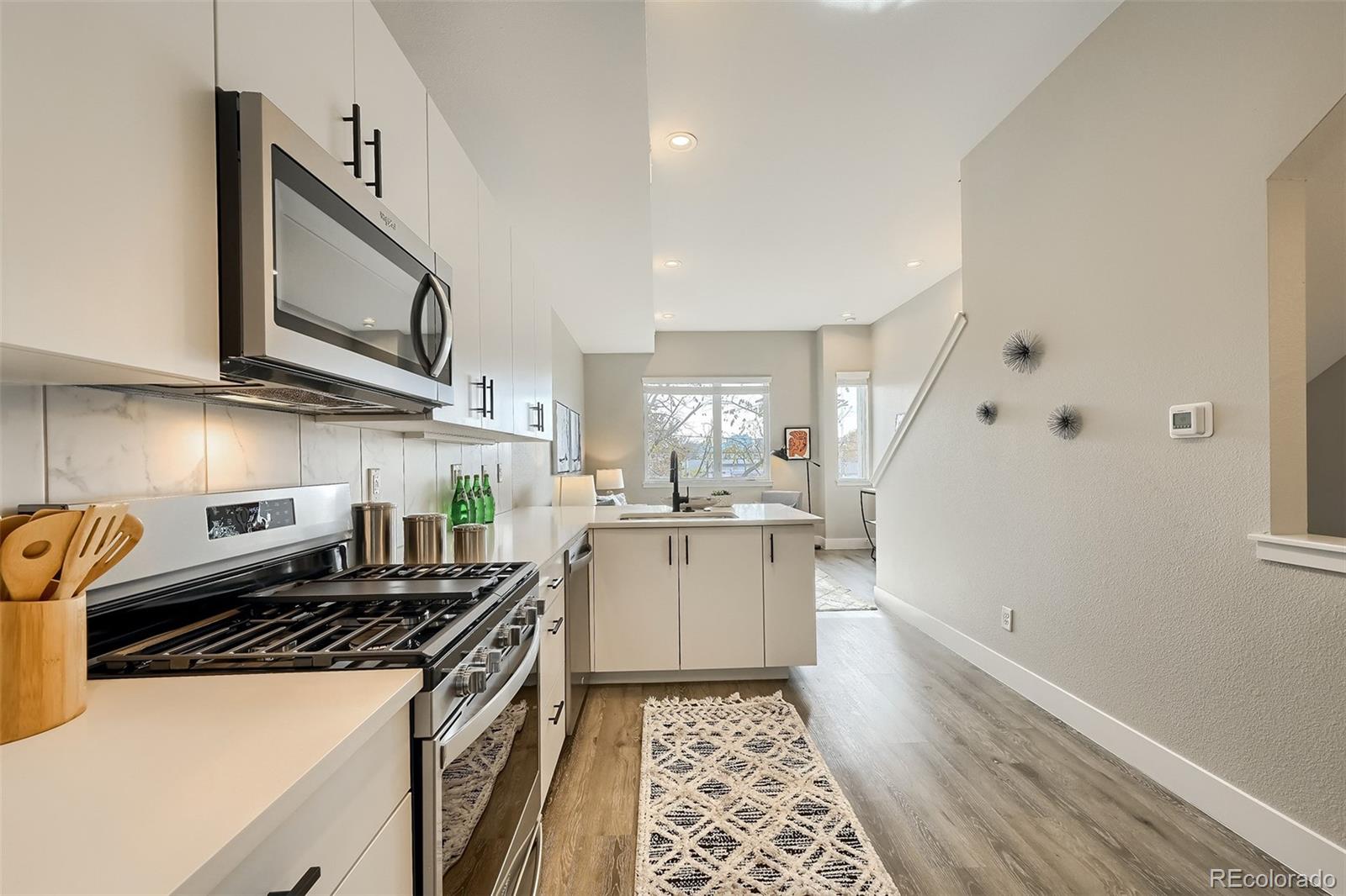 3820 Jason Street, Unit 6 Denver, CO 80211 - Photo 15 of 36 a kitchen with a sink and a stove top oven