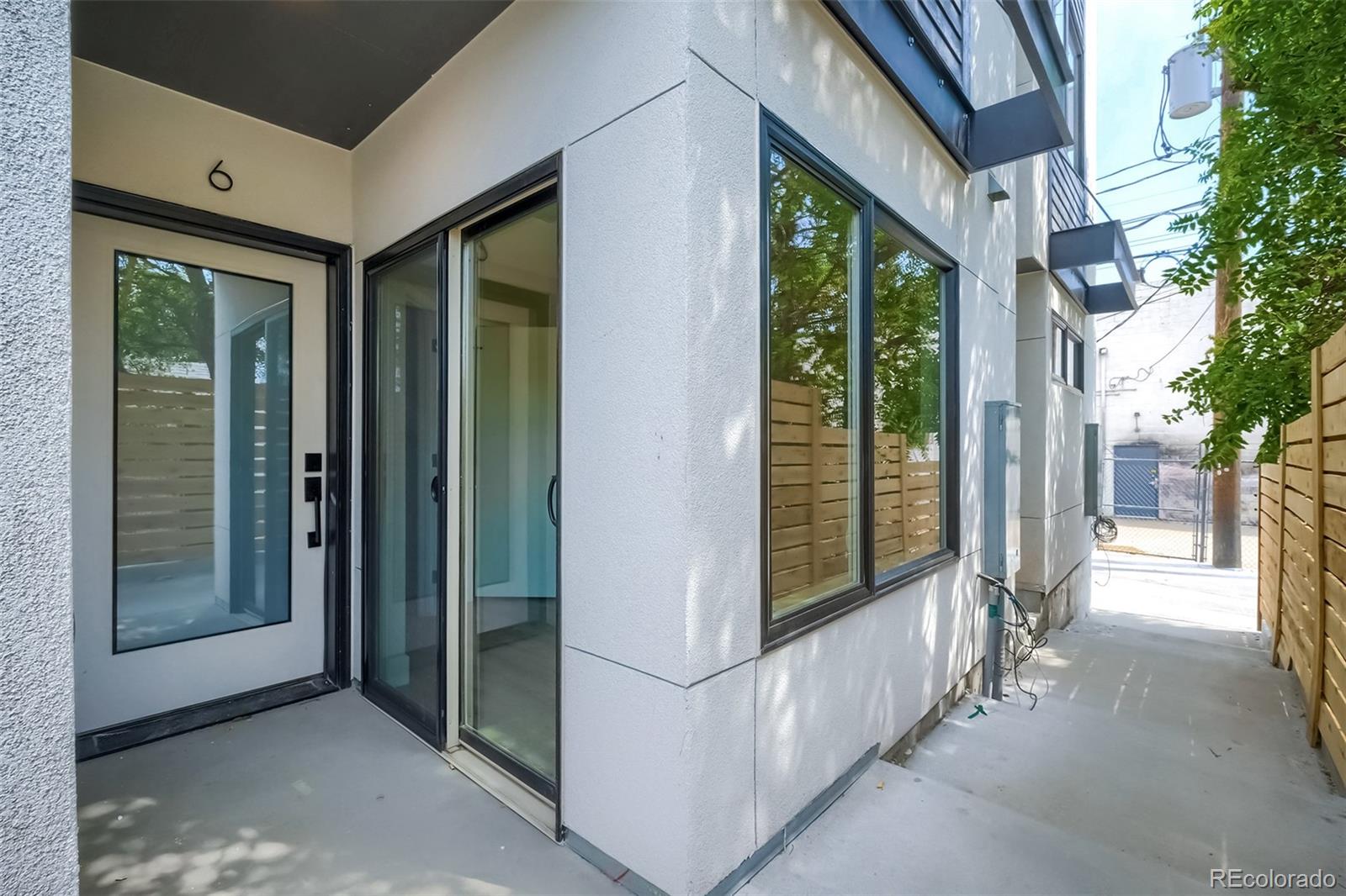 3820 Jason Street, Unit 6 Denver, CO 80211 - Photo 2 of 36 a view of a porch with wooden floor and garden
