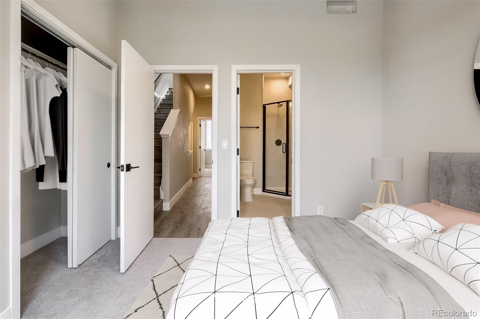 3820 Jason Street, Unit 6 Denver, CO 80211 - Photo 24 of 36 a bedroom with a bed and a walk in closet