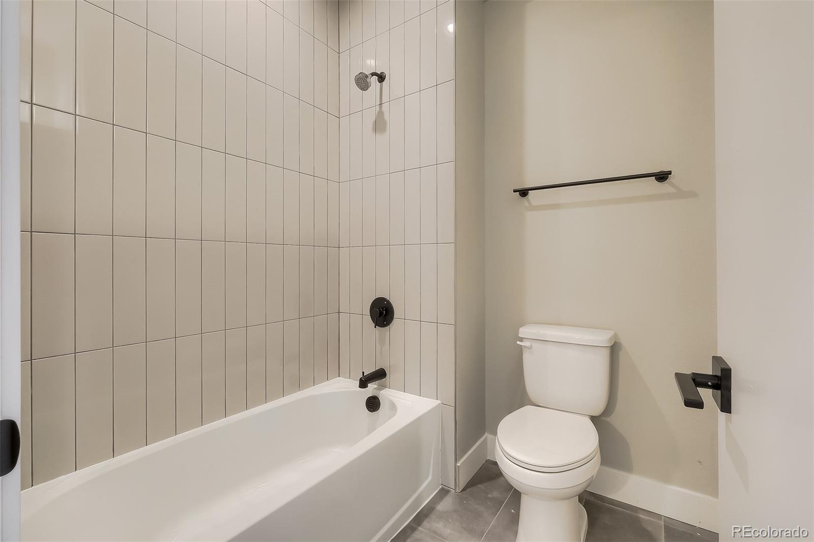 3820 Jason Street, Unit 6 Denver, CO 80211 - Photo 29 of 36 a white toilet sitting next to a bath tub and shower