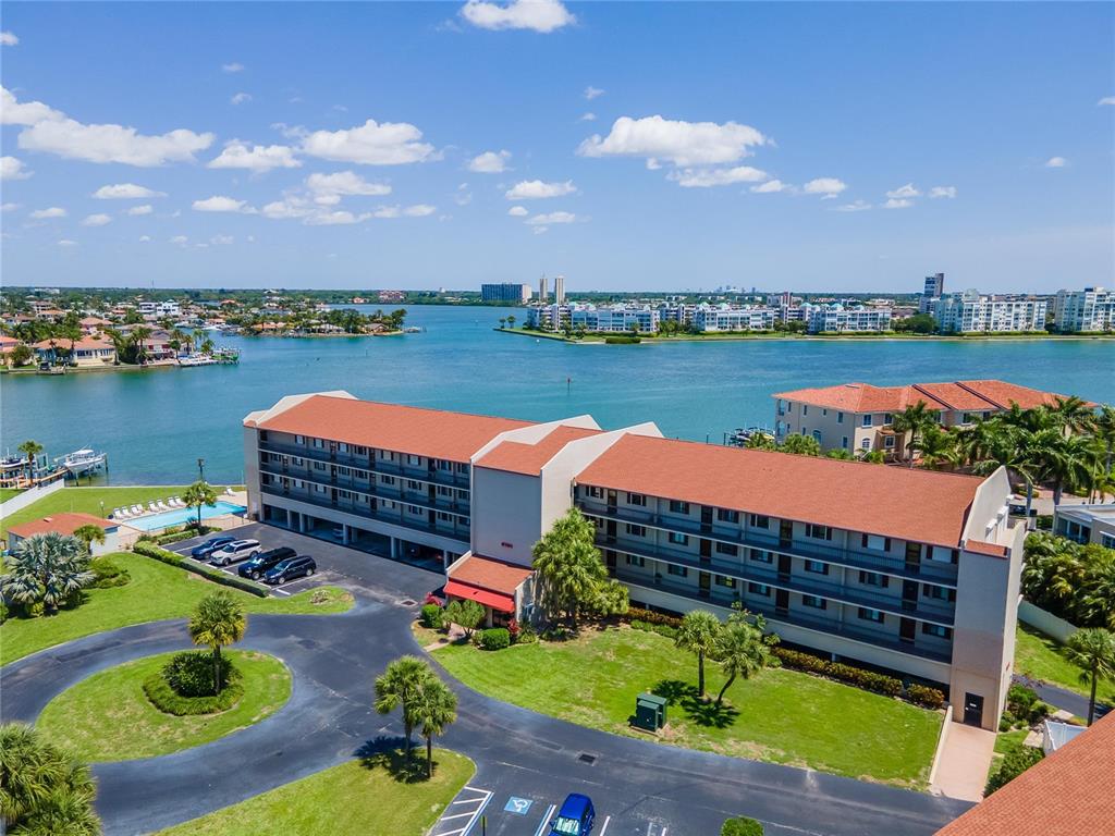 8701 Blind Pass Road, Unit 302B St. Pete Beach, FL 33706 - Photo 1 of 1 an aerial view of a house with outdoor space pool patio and outdoor seating