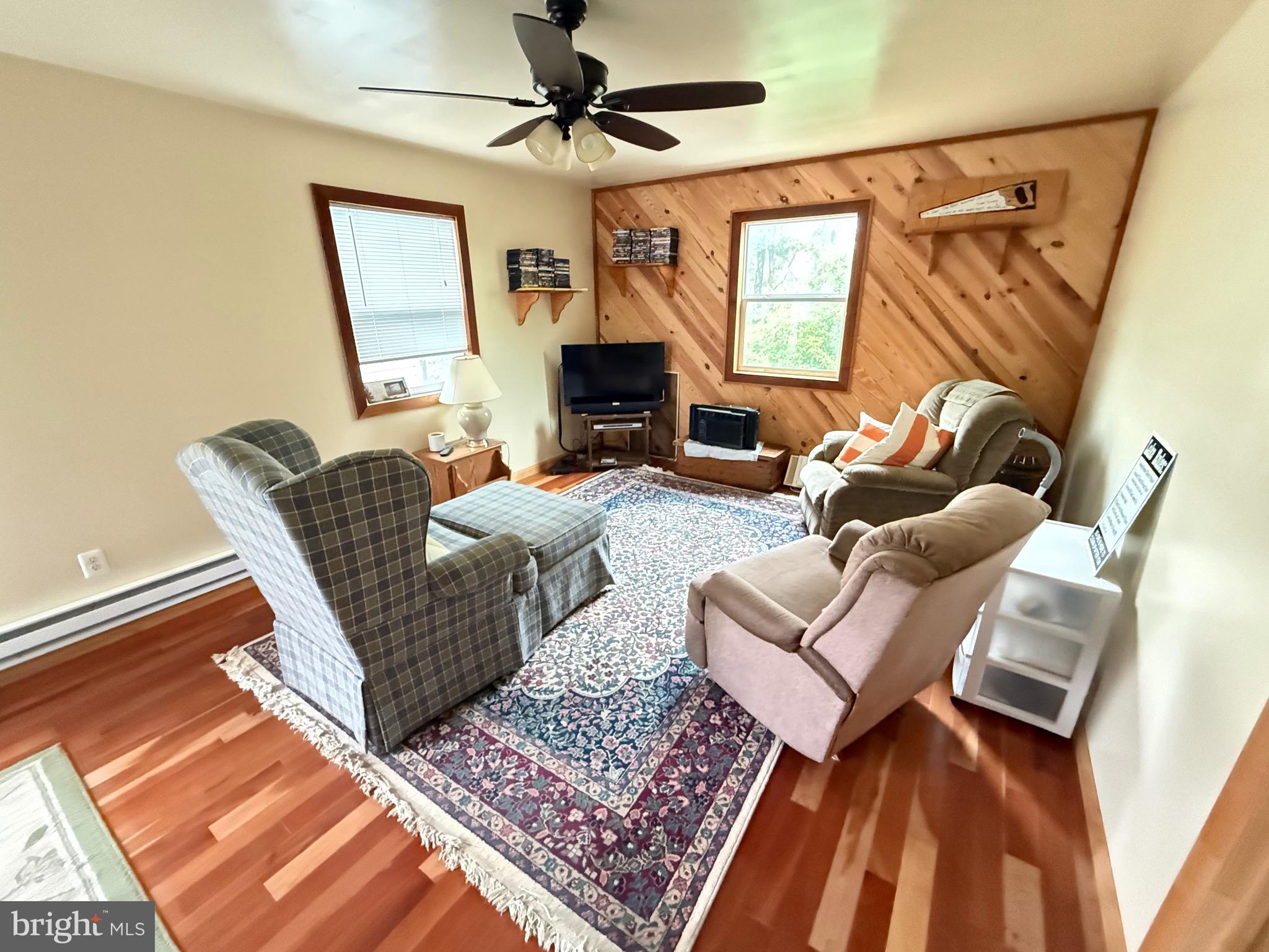 106 North Rock Ridge Lane Mount Storm, WV 26739 - Photo 28 of 78 a living room with furniture and a fireplace