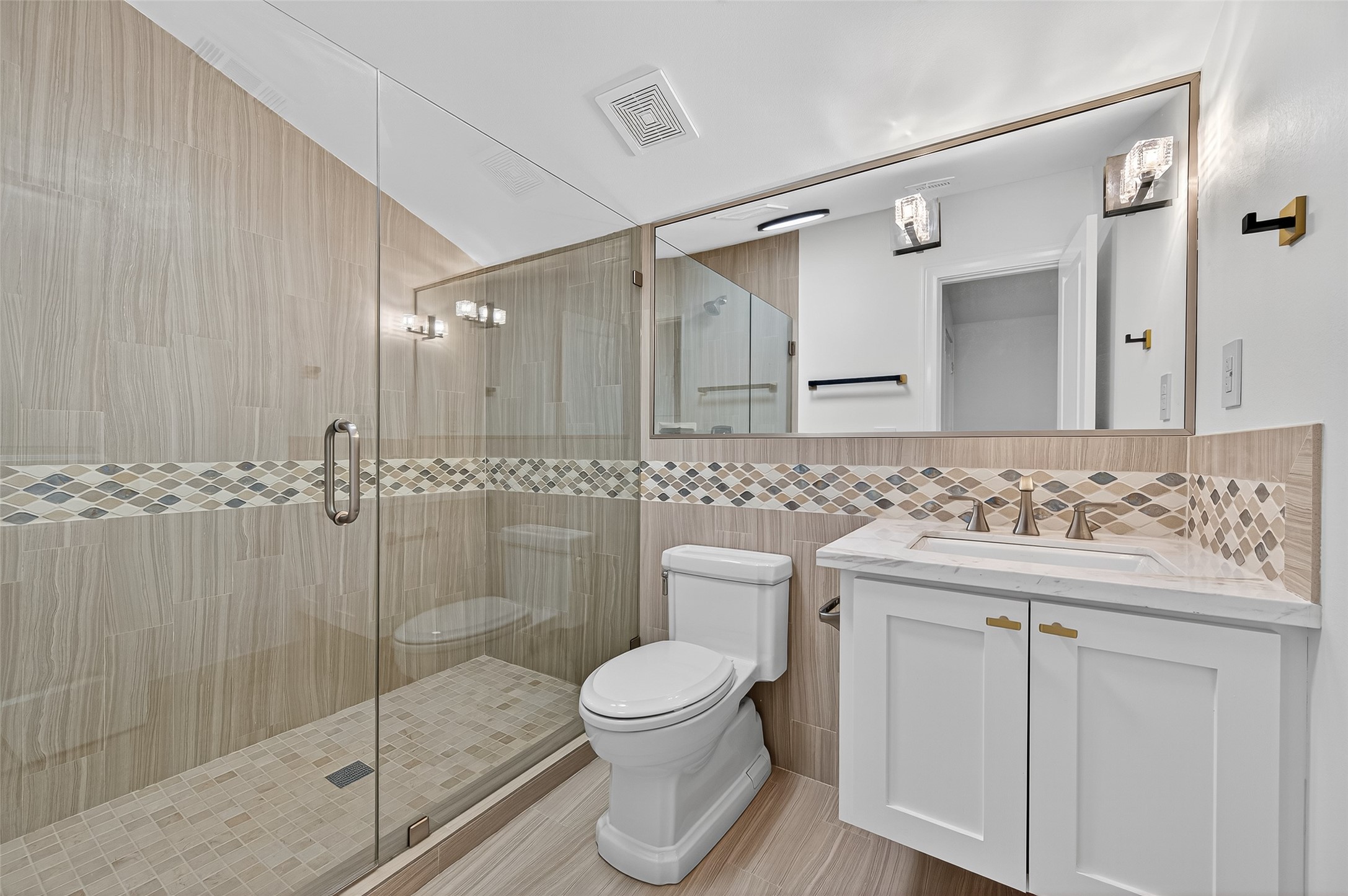 28 Riva Row Spring, TX 77380 - Photo 34 of 48 a bathroom with a toilet sink and mirror