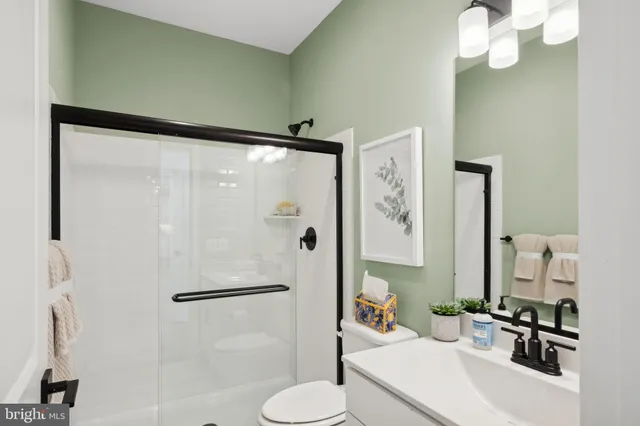 a bedroom with bed and large window