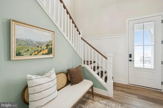 a spacious bedroom with a large bed and a dresser