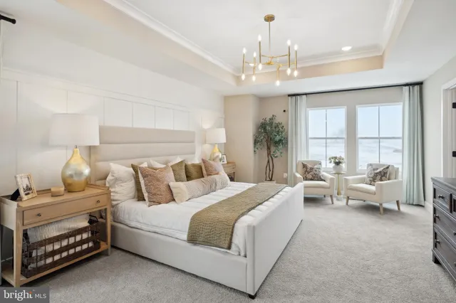 a spacious bathroom with a tub sink and mirror
