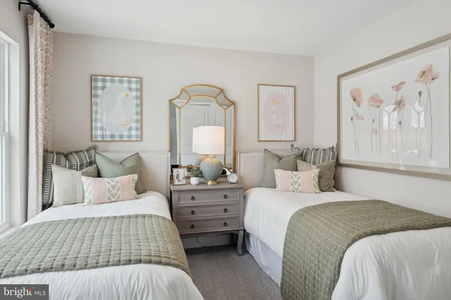 a bedroom with a bed and a lamp