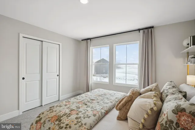 a view of a livingroom with furniture and a mirror