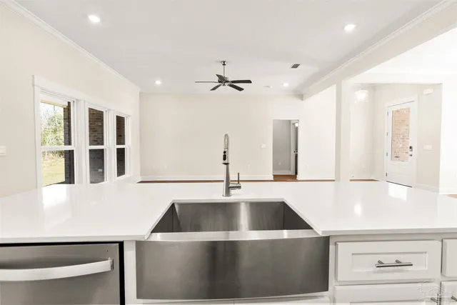 a kitchen with a sink and a refrigerator