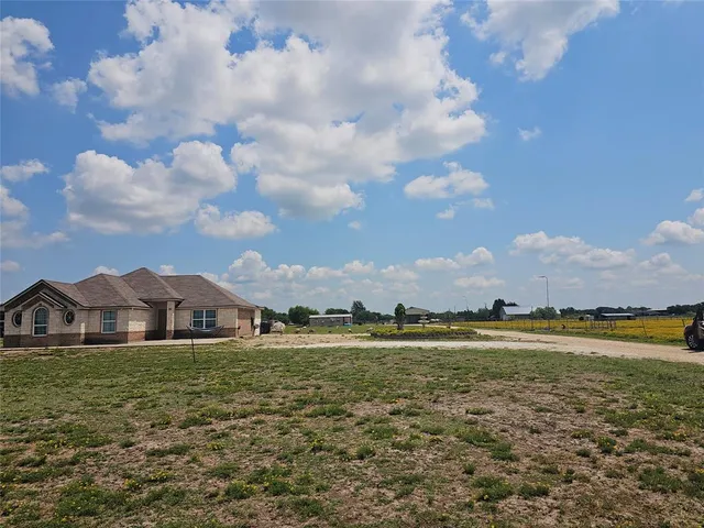 a view of a town with an ocean and a houses
