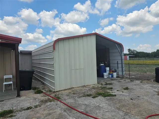 a back view of a house with backyard
