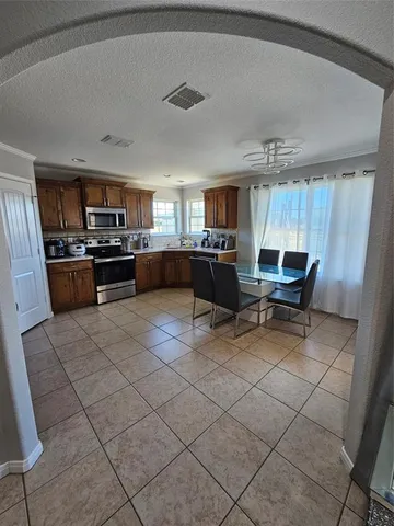 a kitchen with a sink a counter top space and appliances