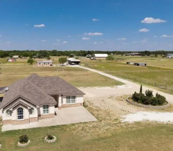 a backyard of a house with a yard