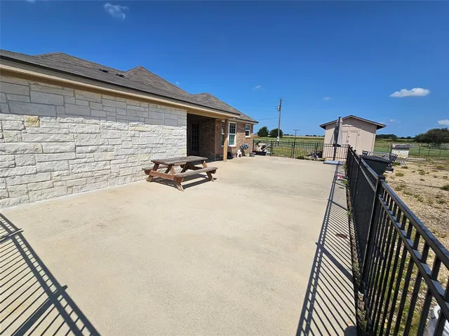 a view of a terrace with chairs