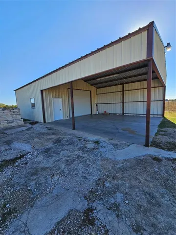 a view of backyard and front door