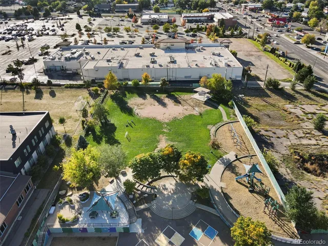 an aerial view of residential houses with outdoor space